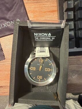 Nixon Stainless Steel Watch Links on Dark Fabric